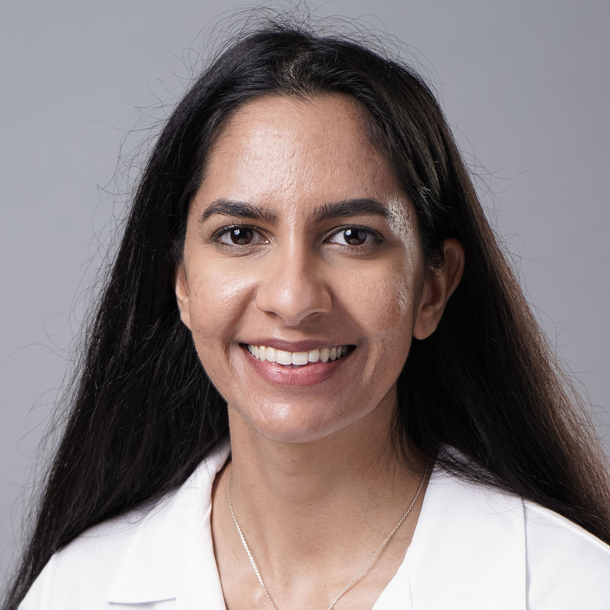 A friendly headshot of Dr. Alisa Chauhan