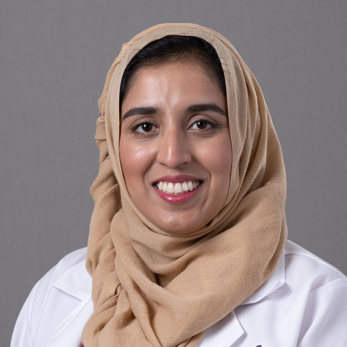 A friendly headshot of Dr. Reja Emran