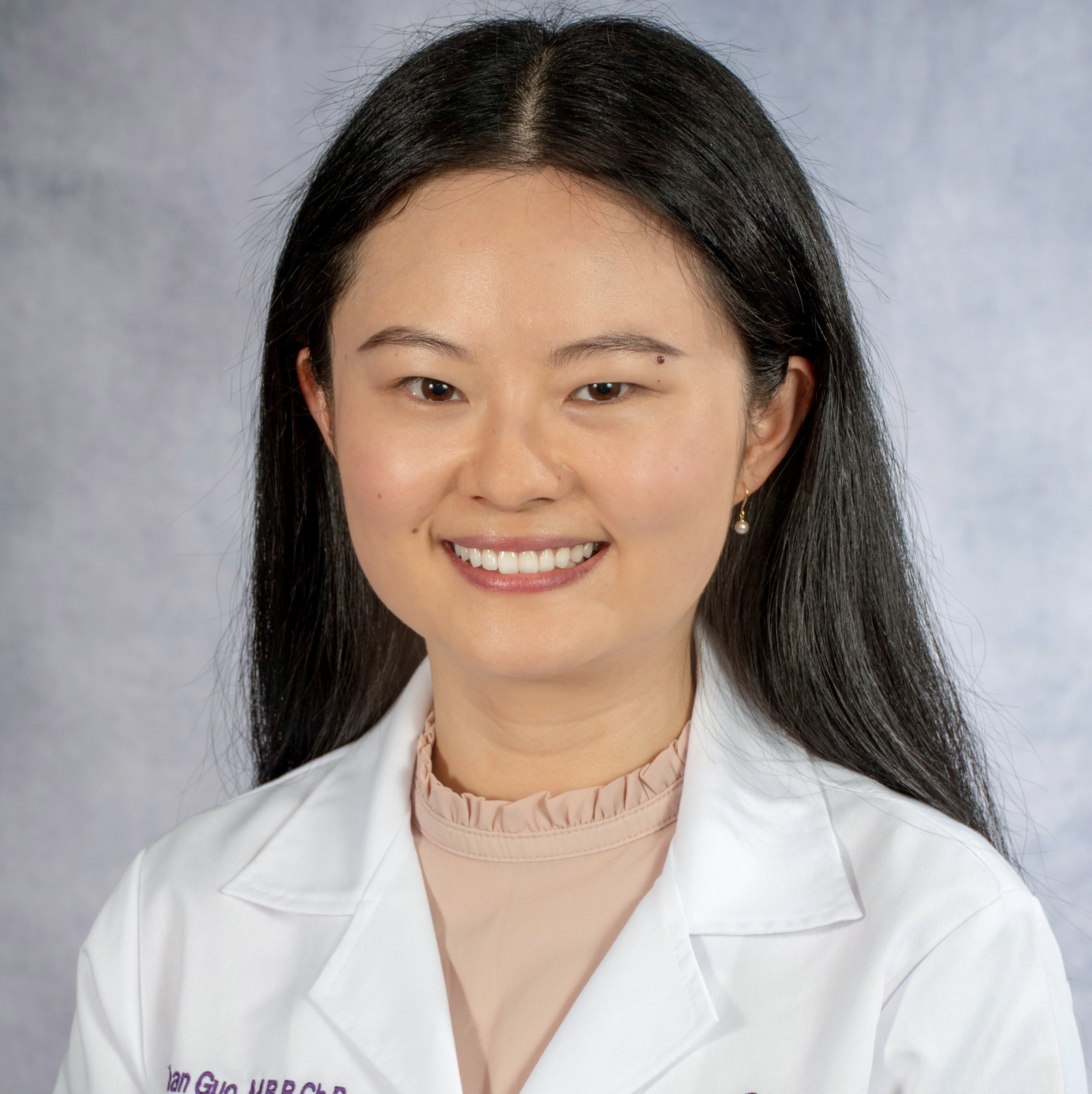 A friendly headshot of Dr. Guo