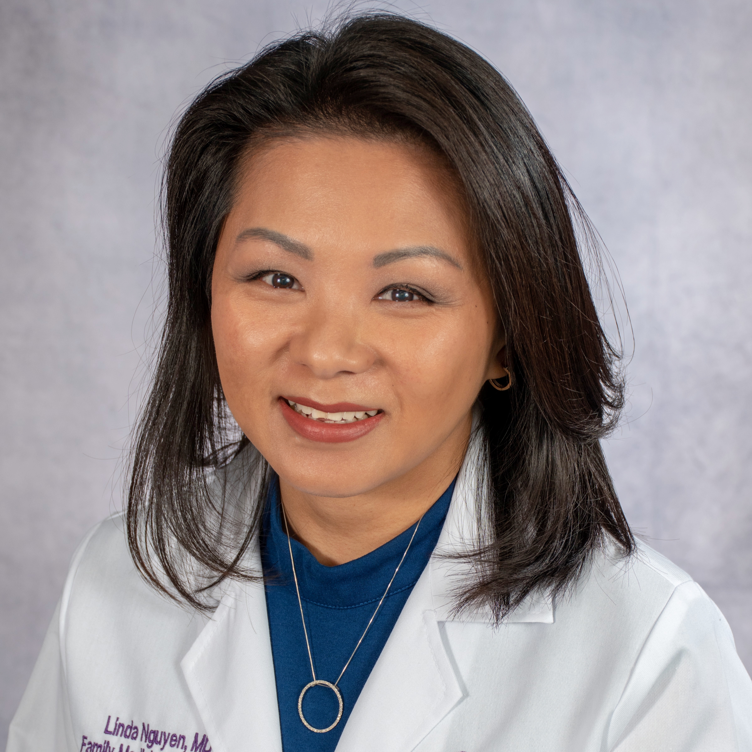 A friendly headshot of Dr. Nguyen